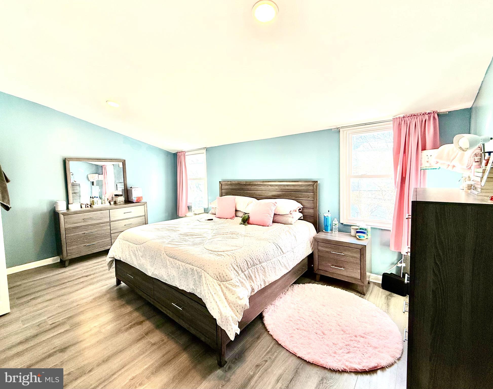 892 North 48th Street Philadelphia, PA 19139 - Photo 10 of 22 a bedroom with a bed and a painting on the wall