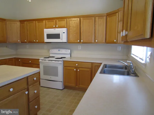 a view of a porch with wooden floor