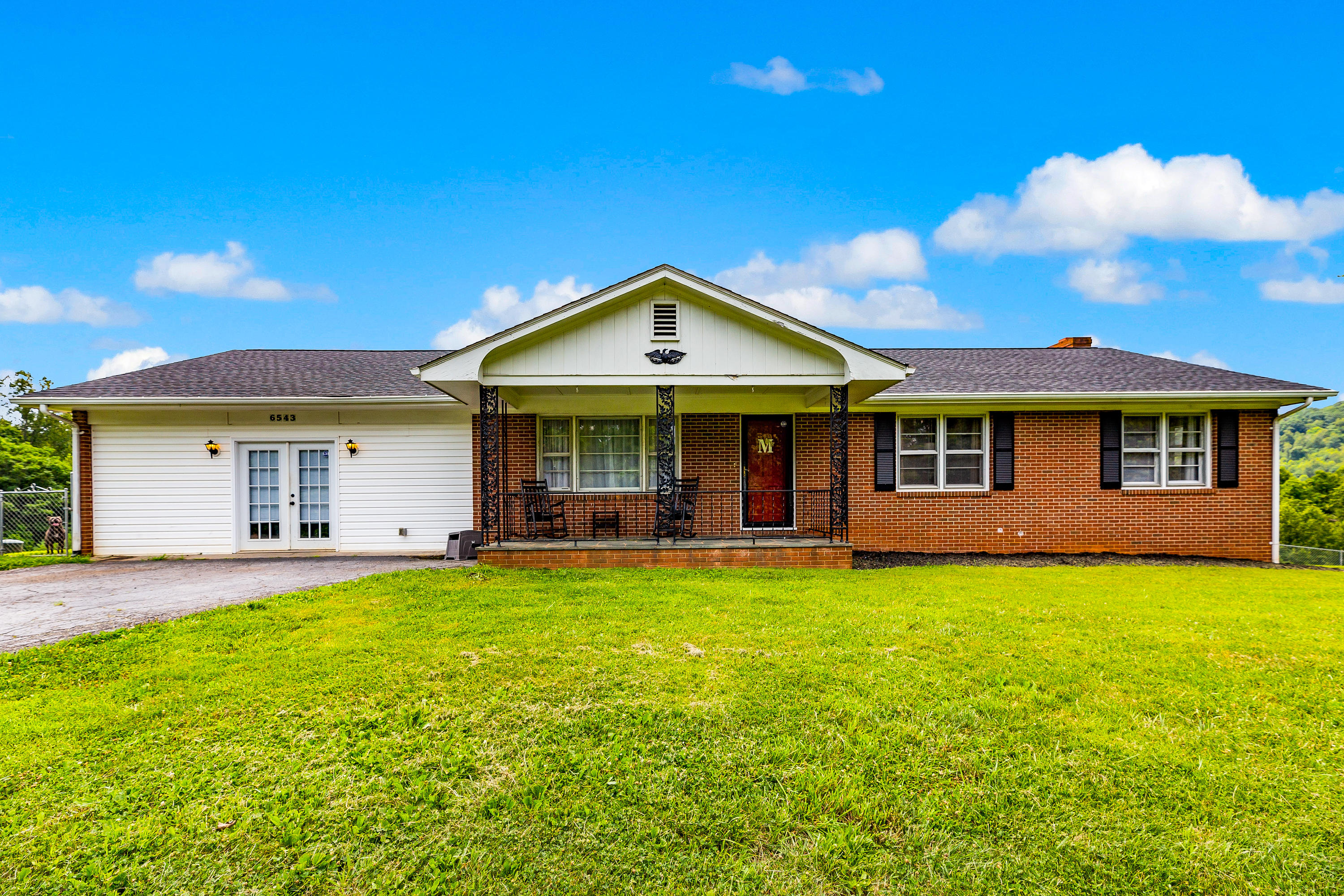 6543 Goodview Road Goodview, VA 24095 - Photo 1 of 21 a front view of a house with a yard and porch