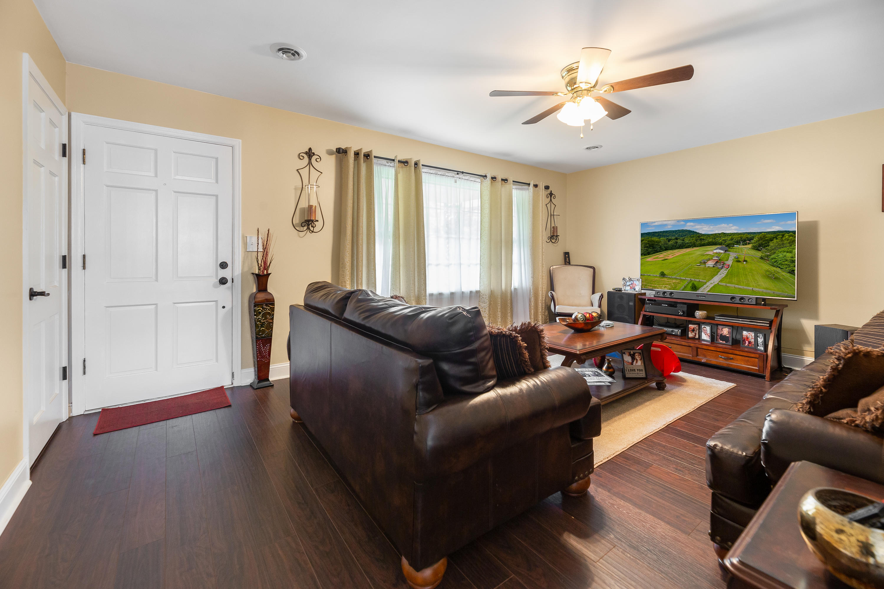 6543 Goodview Road Goodview, VA 24095 - Photo 7 of 21 a living room with furniture and a flat screen tv
