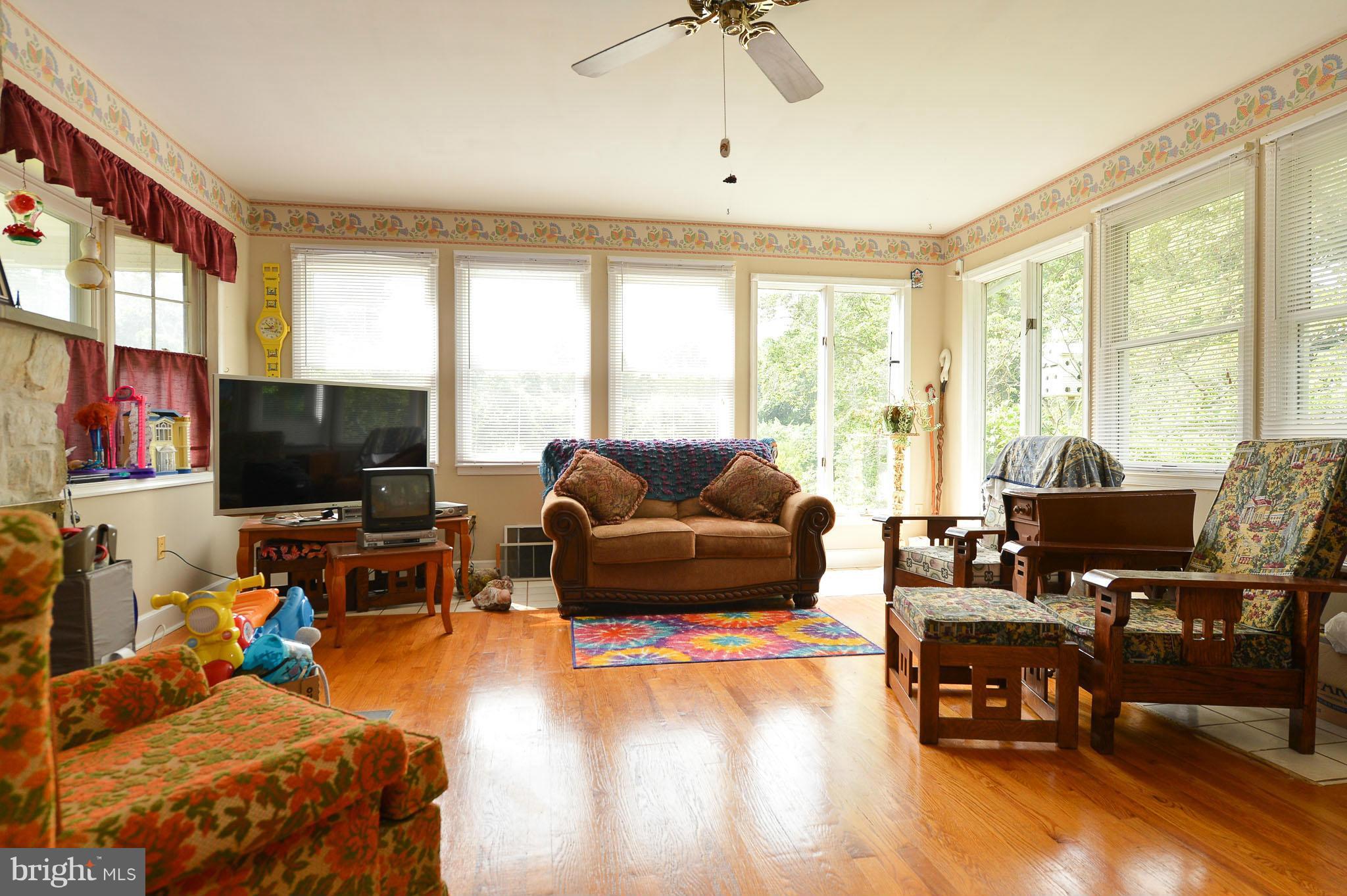 2466 Theodore Road North East, MD 21901 - Photo 14 of 22 a living room with furniture and a flat screen tv
