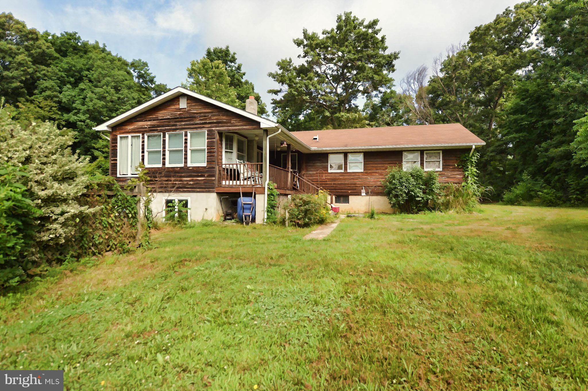 2466 Theodore Road North East, MD 21901 - Photo 4 of 22 a front view of a house with a yard