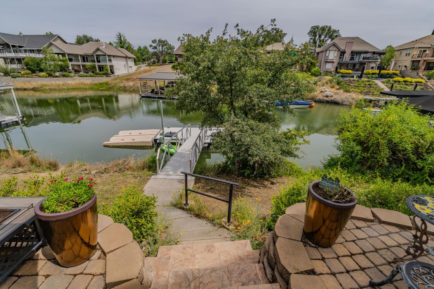 6066 Bluff View Road Copperopolis, CA 95228 - Photo 74 of 96 a view of a lake with couches and city view
