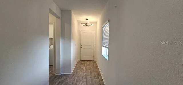 a view of a bathroom with wooden floor