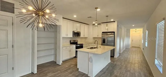 a kitchen with a refrigerator a sink and dishwasher