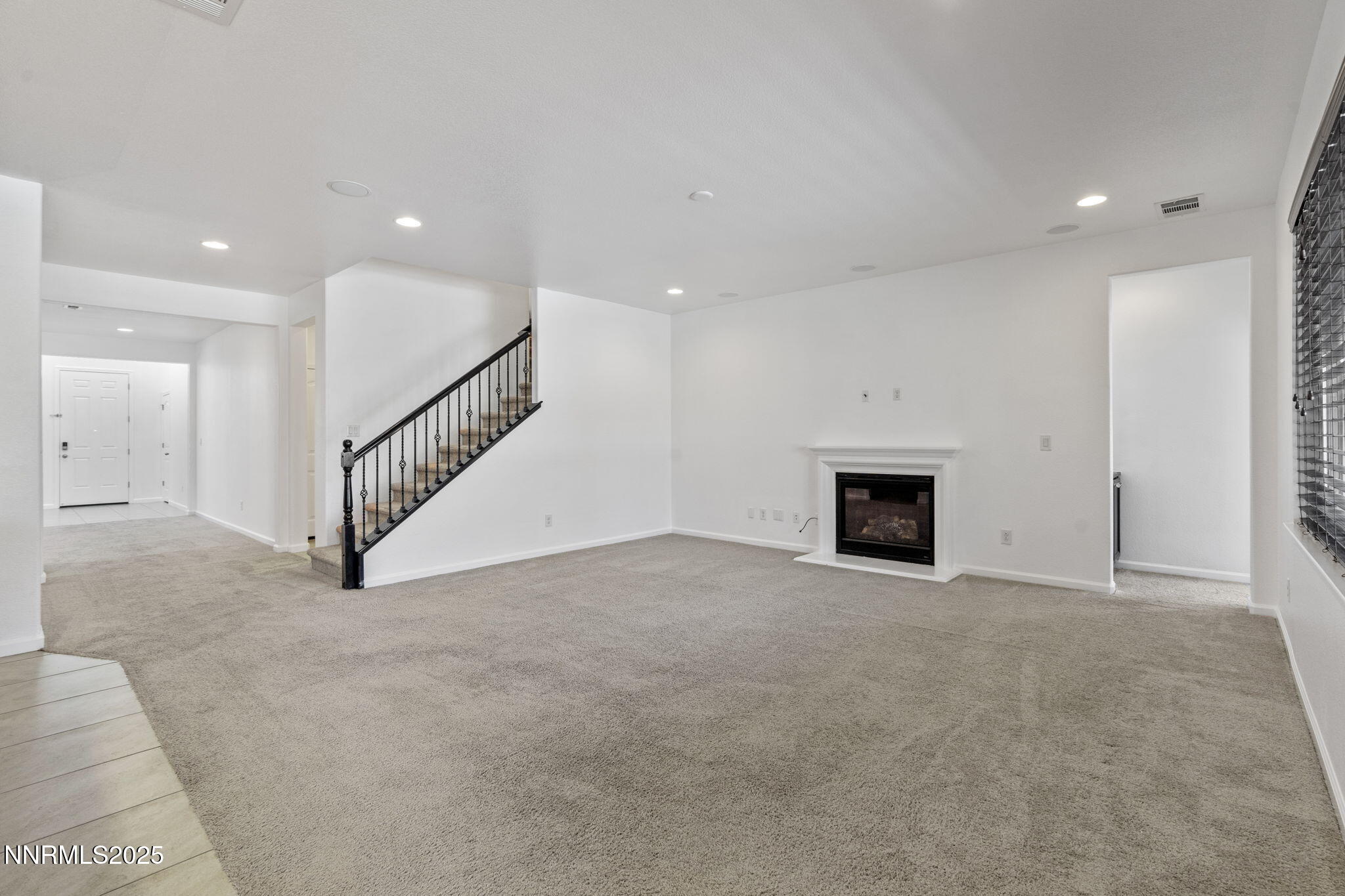 2028 Bayview Drive Reno, NV 89521 - Photo 11 of 33 a view of an empty room with a fireplace