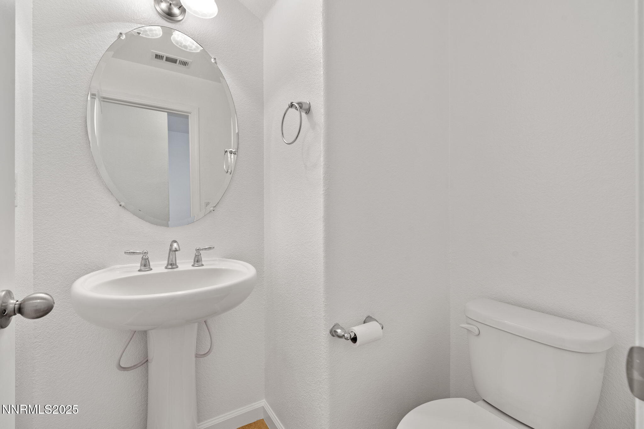 2028 Bayview Drive Reno, NV 89521 - Photo 14 of 33 a bathroom with a toilet sink and mirror