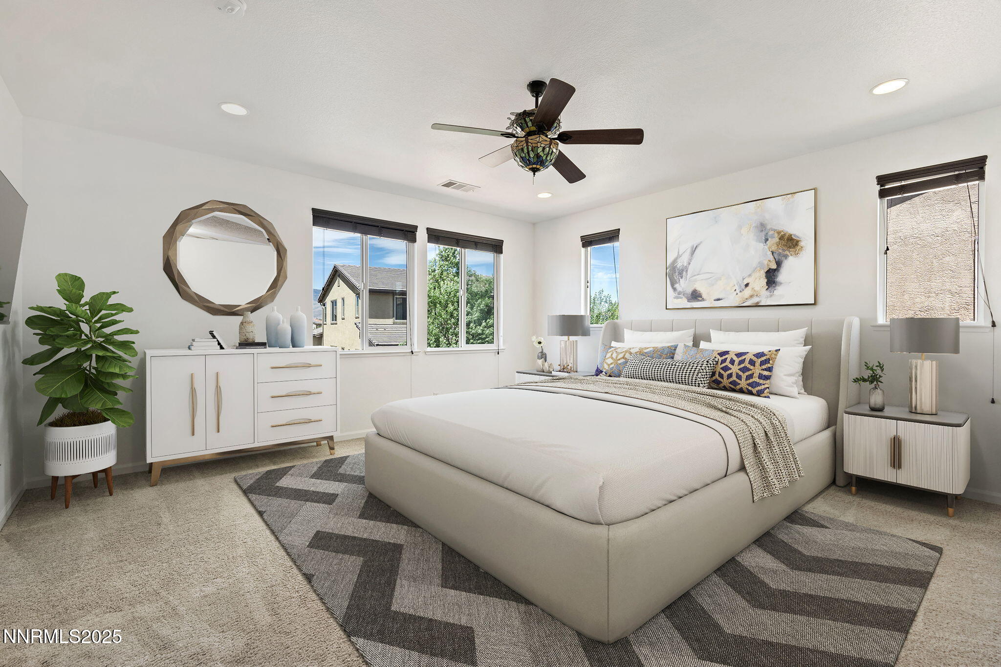 2028 Bayview Drive Reno, NV 89521 - Photo 18 of 33 a bedroom with a large bed and a chandelier