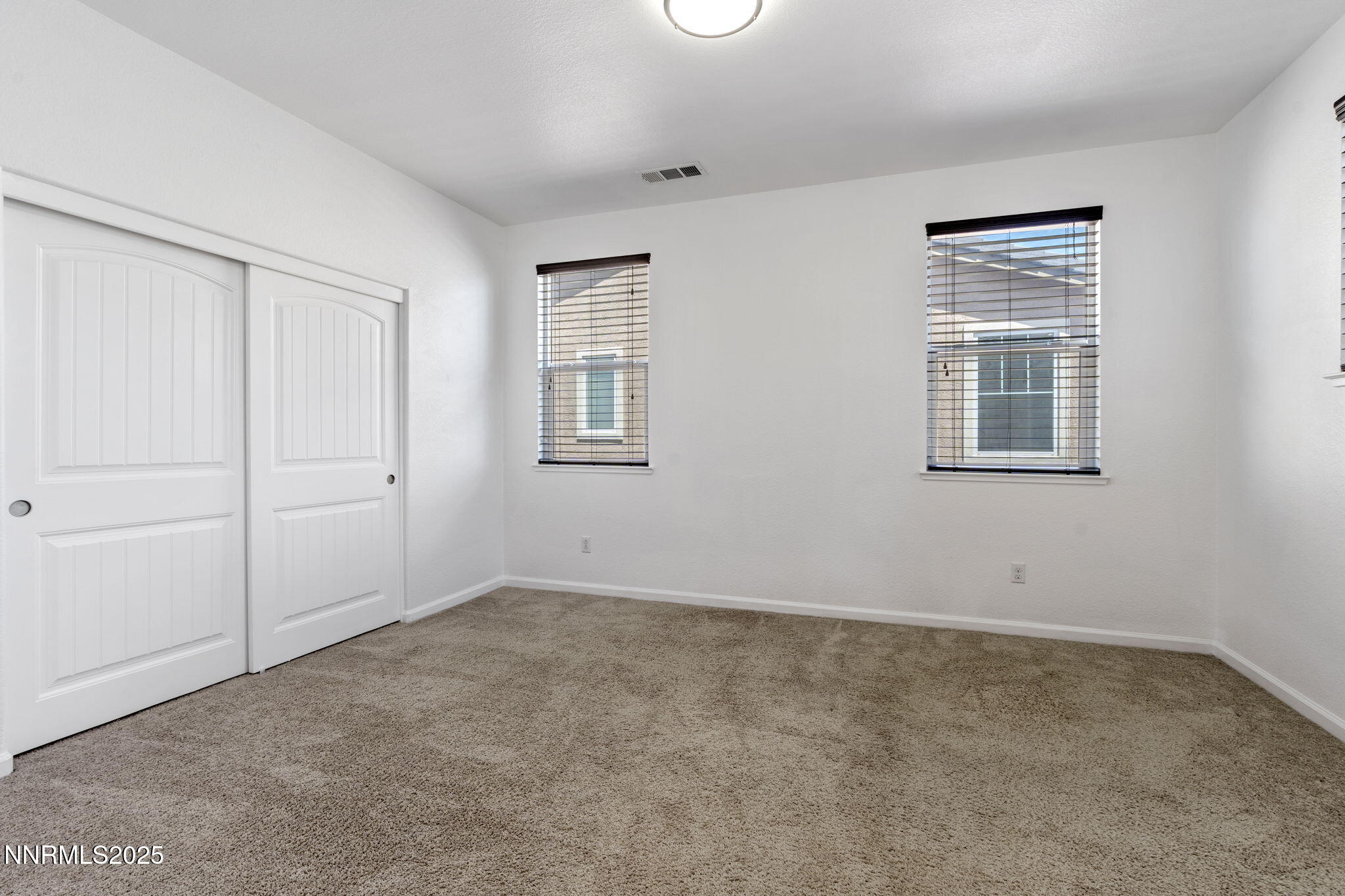 2028 Bayview Drive Reno, NV 89521 - Photo 21 of 33 an empty room with windows