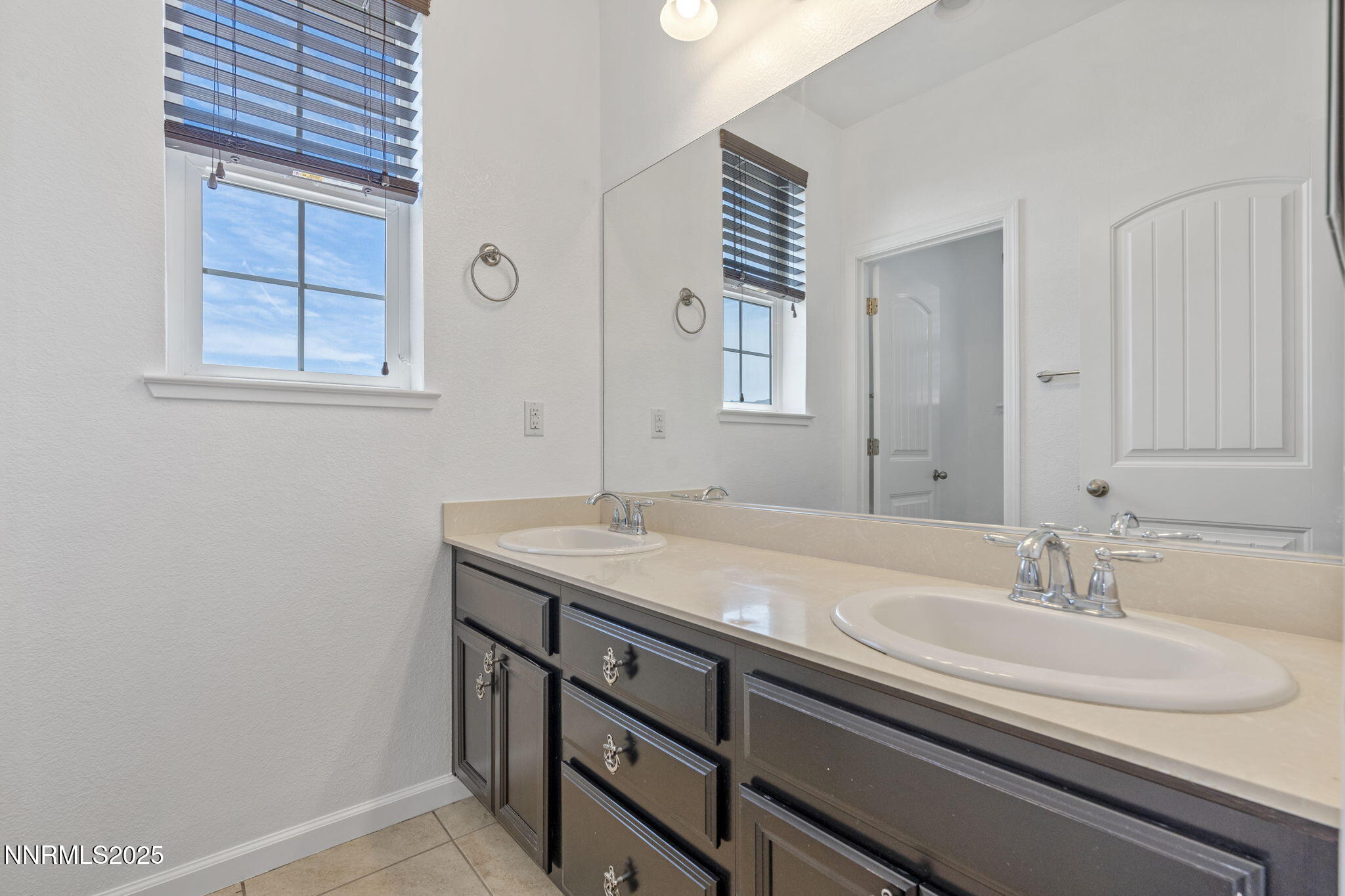 2028 Bayview Drive Reno, NV 89521 - Photo 22 of 33 a bathroom with a sink and a mirror