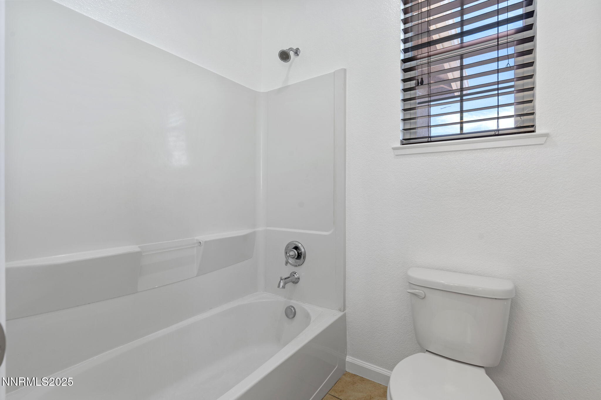 2028 Bayview Drive Reno, NV 89521 - Photo 23 of 33 a white toilet sitting next to a bath tub