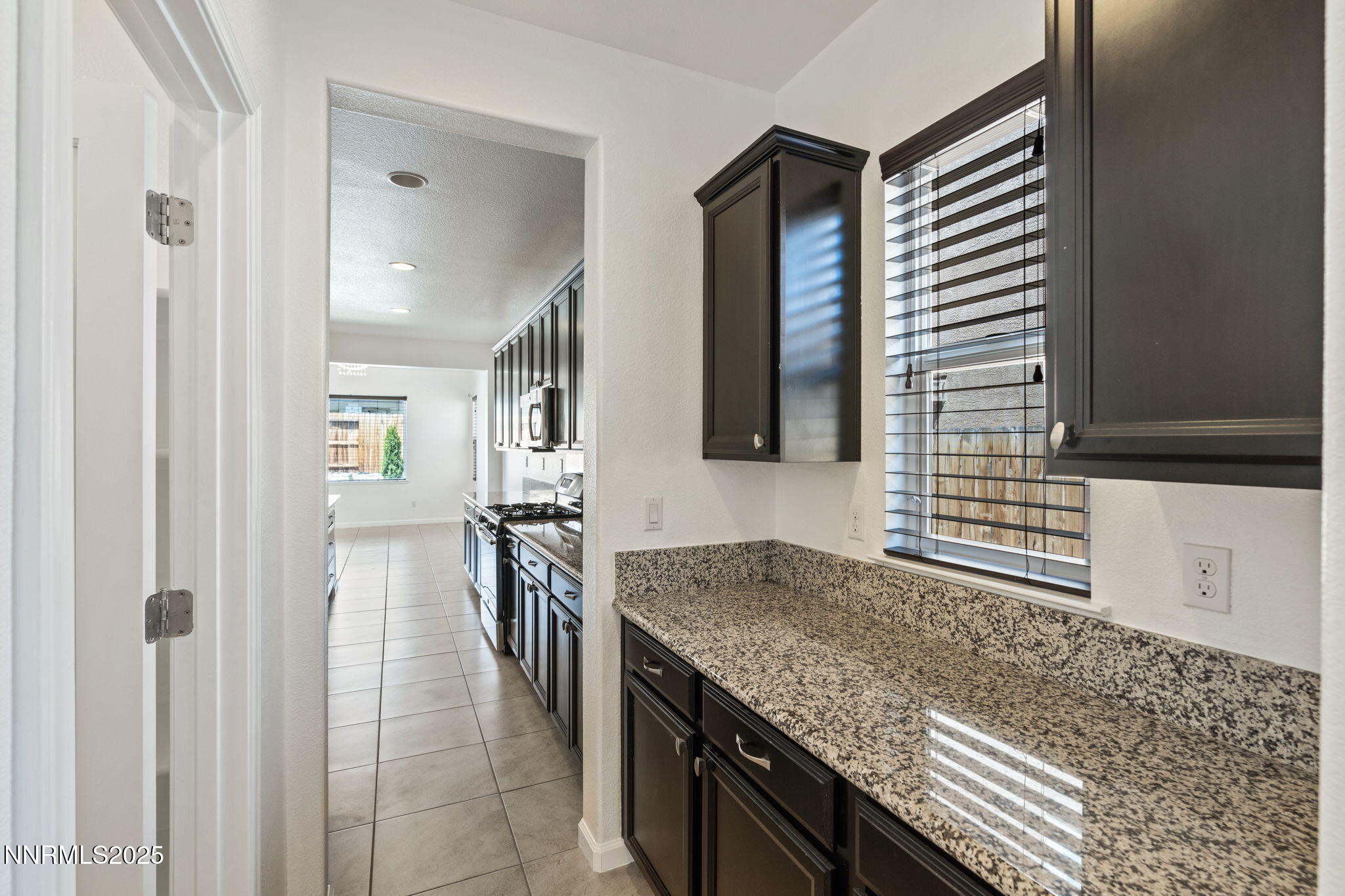 2028 Bayview Drive Reno, NV 89521 - Photo 4 of 33 a kitchen with stainless steel appliances granite countertop a sink and a refrigerator