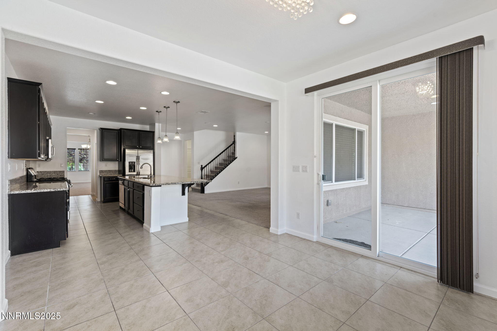 2028 Bayview Drive Reno, NV 89521 - Photo 9 of 33 a view of a living room kitchen with stainless steel appliances kitchen island granite countertop a refrigerator and a sink
