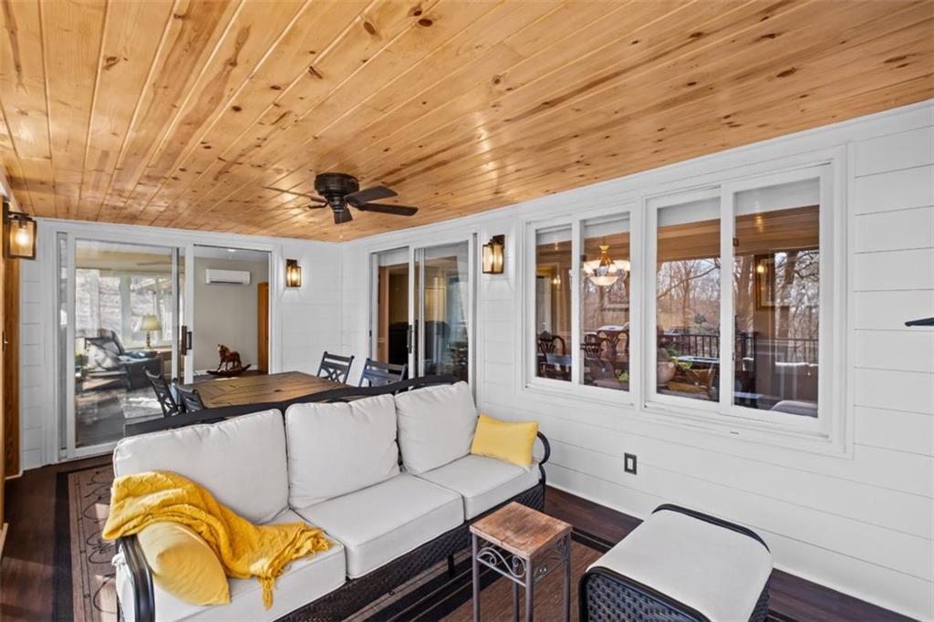 119 Soaring Hawk Circle Big Canoe, GA 30143 - Photo 17 of 50 a view of a living room and balcony with furniture