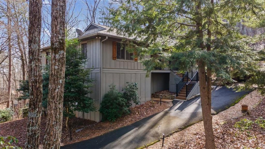 119 Soaring Hawk Circle Big Canoe, GA 30143 - Photo 34 of 50 a view of a house with backyard and trees