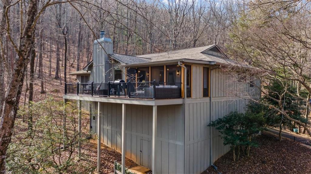 119 Soaring Hawk Circle Big Canoe, GA 30143 - Photo 37 of 50 a front view of a house with garden