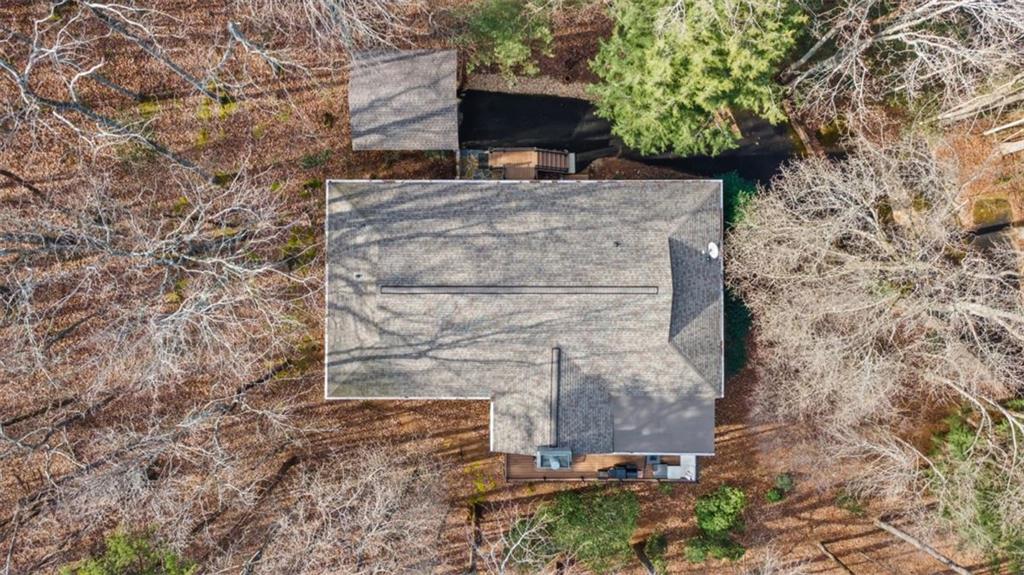 119 Soaring Hawk Circle Big Canoe, GA 30143 - Photo 38 of 50 view of a stone wall with a tree