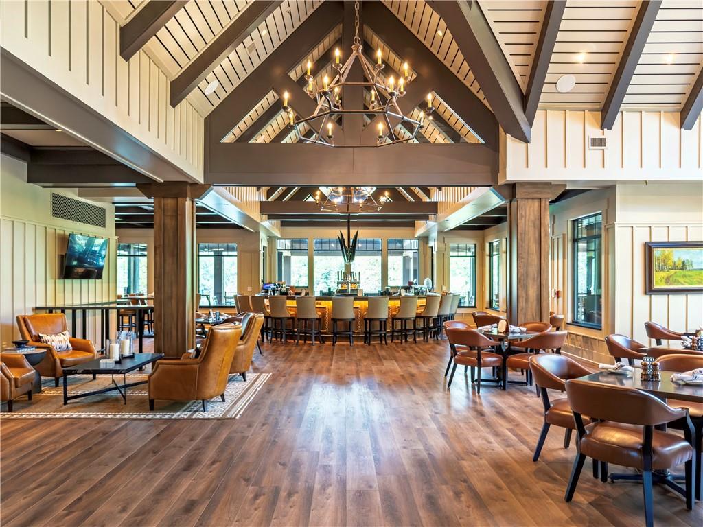 119 Soaring Hawk Circle Big Canoe, GA 30143 - Photo 40 of 50 a living room with furniture a chandelier and a large window