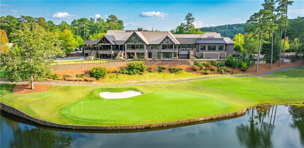 119 Soaring Hawk Circle Big Canoe, GA 30143 - Photo 45 of 50 a view of a swimming pool with lawn chairs and plants