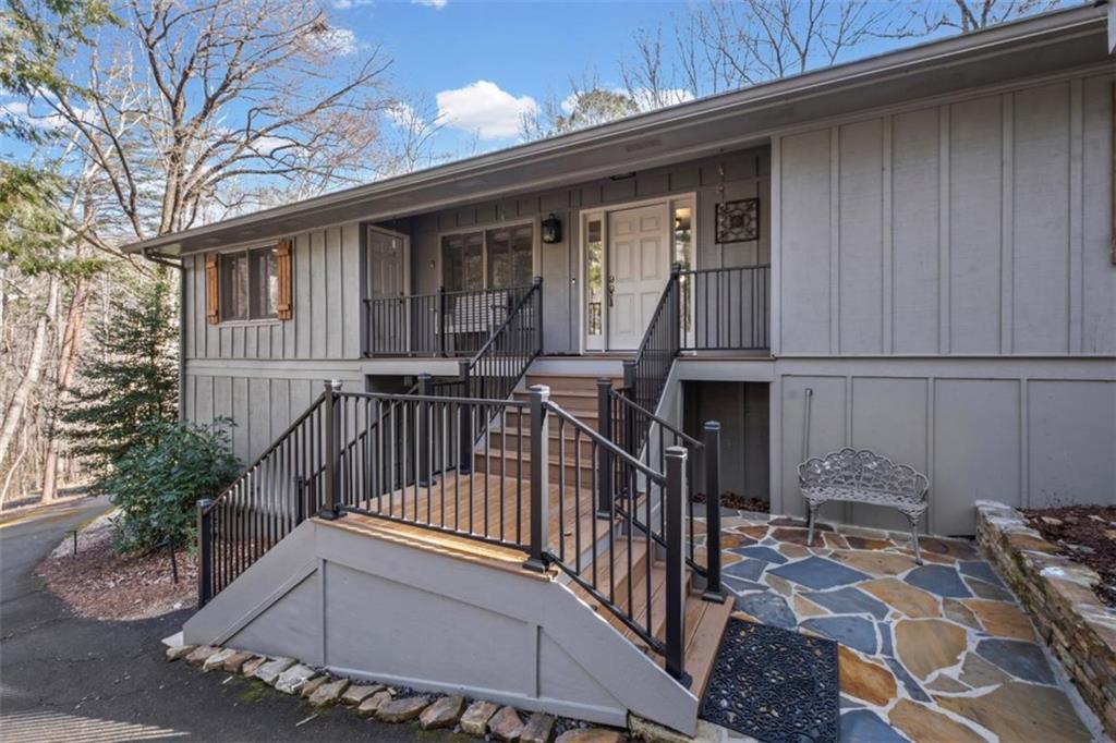 119 Soaring Hawk Circle Big Canoe, GA 30143 - Photo 7 of 50 a view of a house with wooden deck and furniture