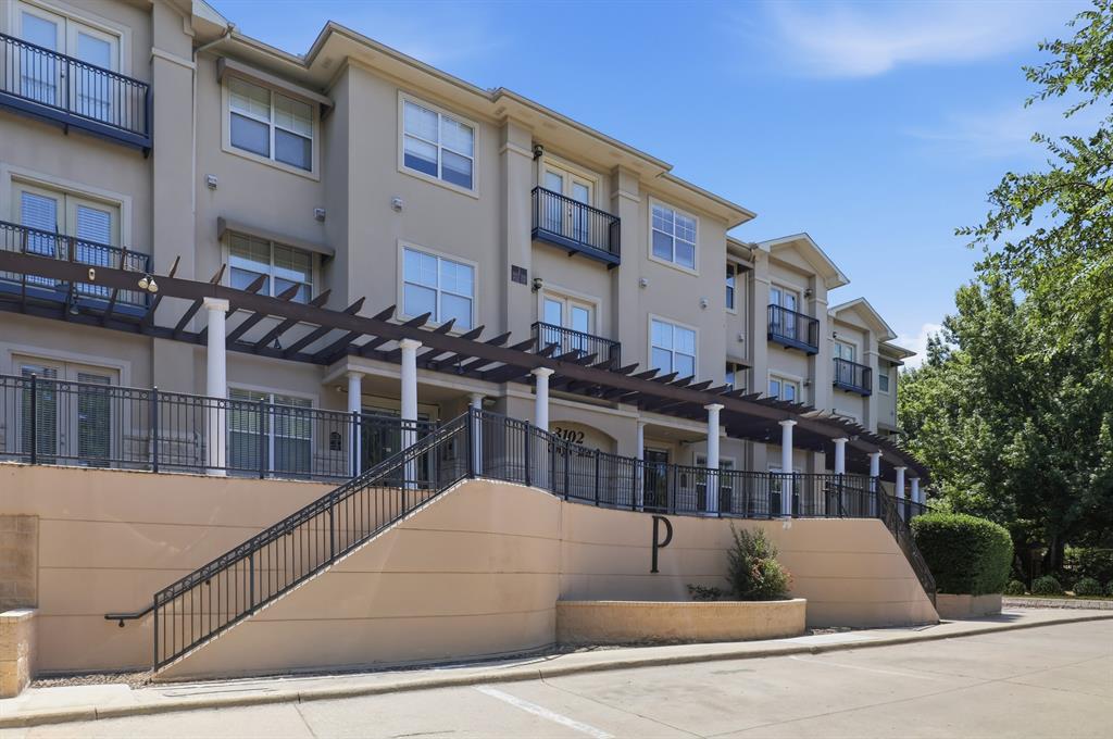 3102 Kings Road, Unit 2212 Dallas, TX 75219 - Photo 26 of 30 a view of building with an outdoor space