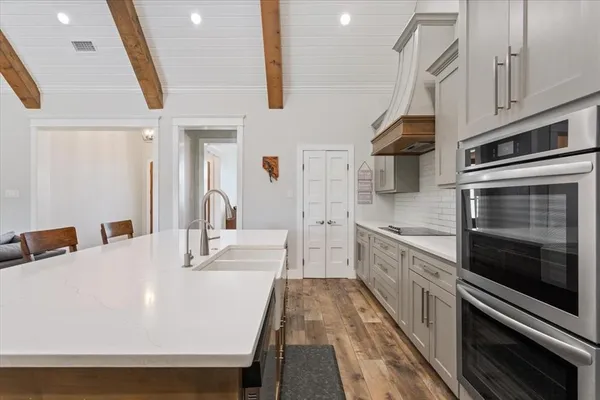 a bathroom with a tub and a sink