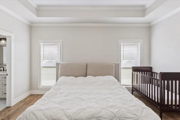 a large white bed in a white room