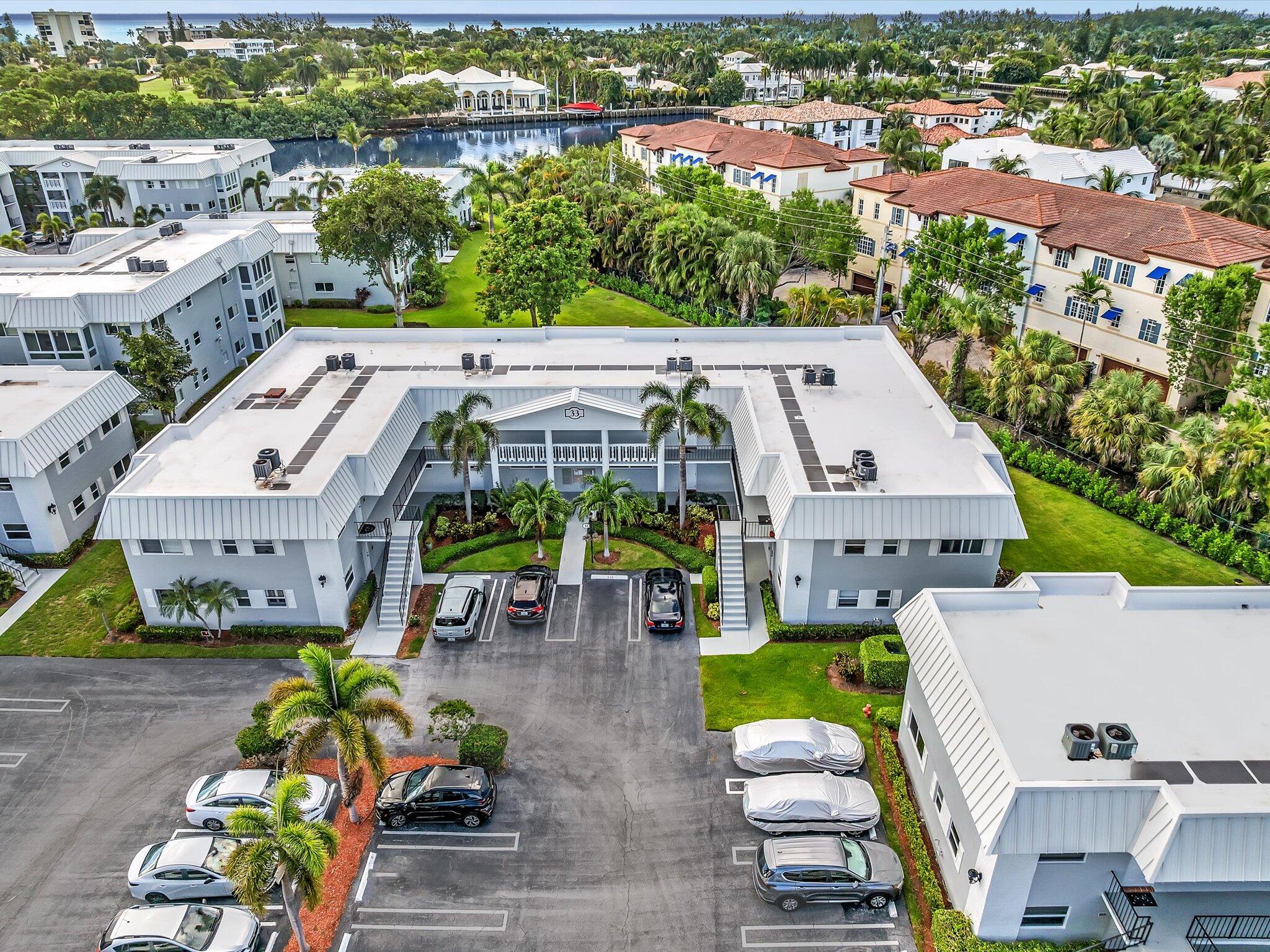 33 Colonial Club Drive, Unit 203 Boynton Beach, FL 33435 - Photo 23 of 61 an aerial view of a house with garden space and patio