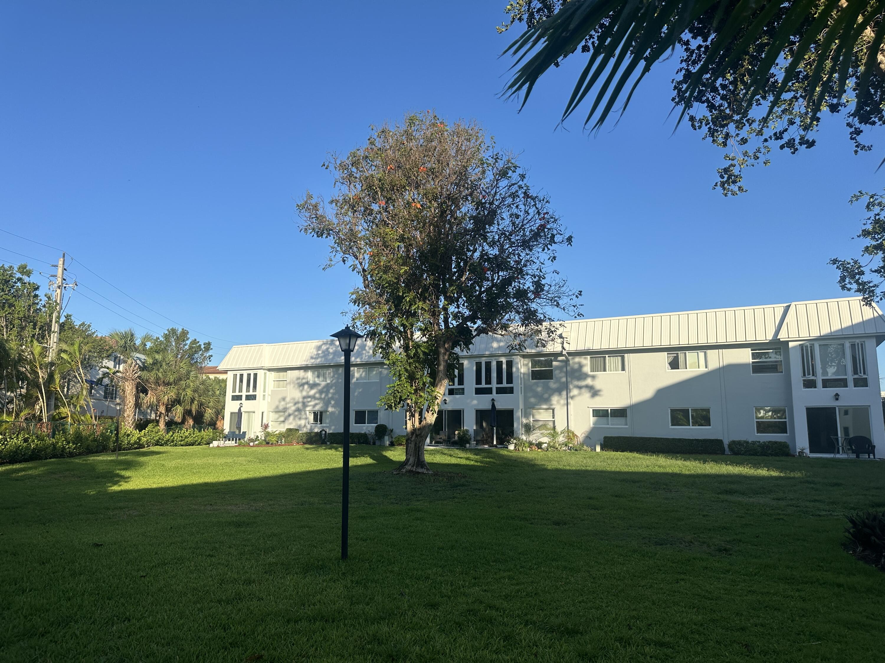 33 Colonial Club Drive, Unit 203 Boynton Beach, FL 33435 - Photo 25 of 61 a view of a house with a big yard