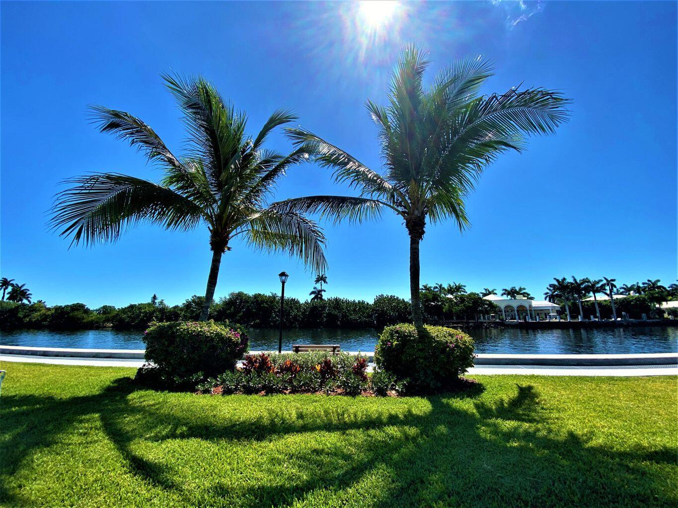 33 Colonial Club Drive, Unit 203 Boynton Beach, FL 33435 - Photo 44 of 61 a front view of a house with garden and ocean view