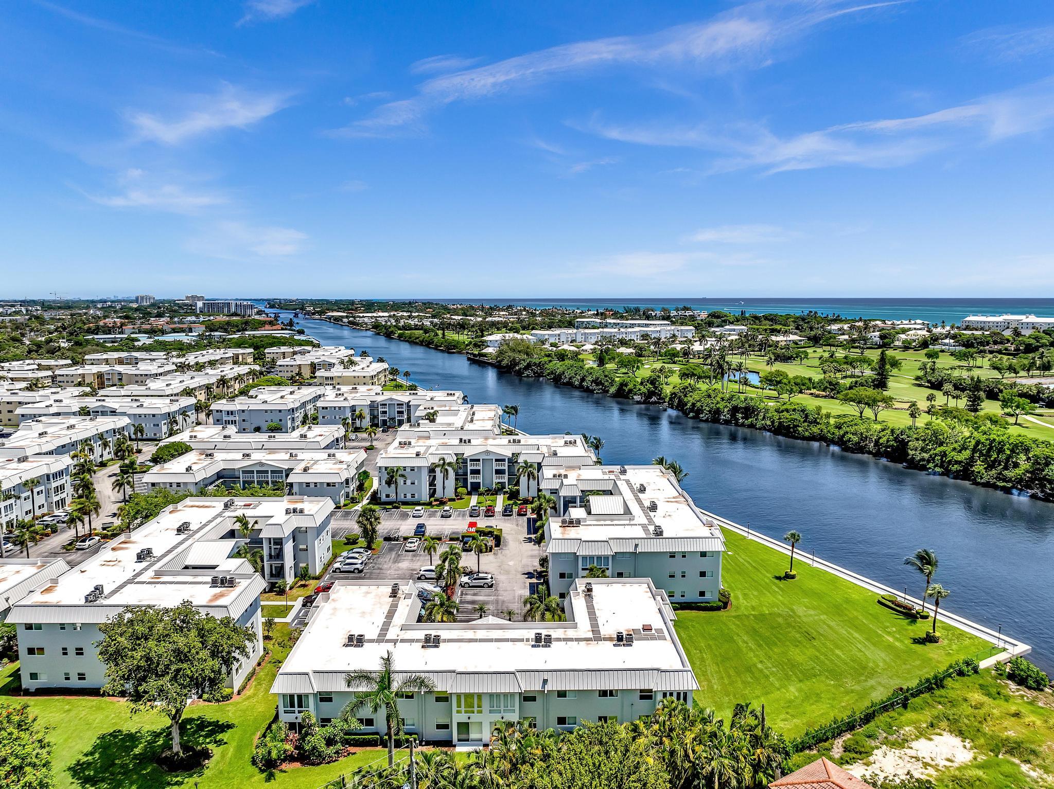 33 Colonial Club Drive, Unit 203 Boynton Beach, FL 33435 - Photo 49 of 61 a view of a lake with a city