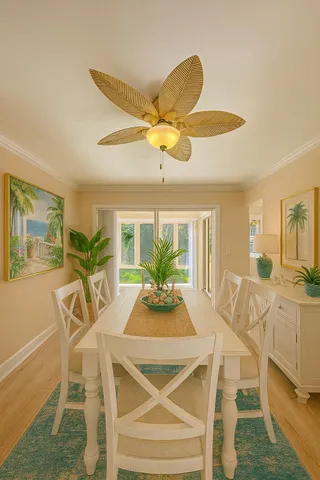 a living room with furniture and floor to ceiling windows