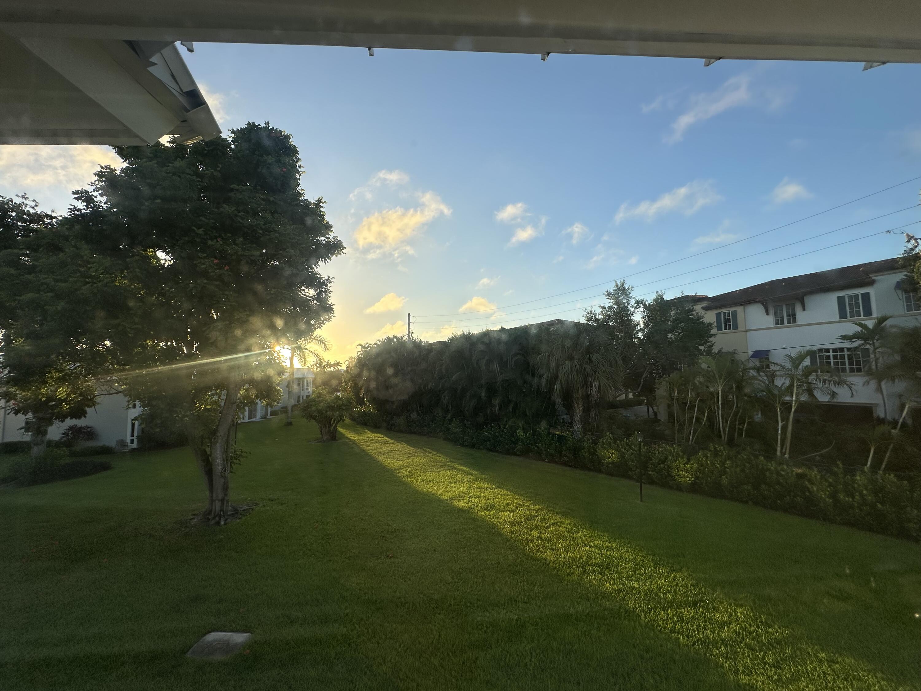 33 Colonial Club Drive, Unit 203 Boynton Beach, FL 33435 - Photo 10 of 61 a view of a golf course with a lake