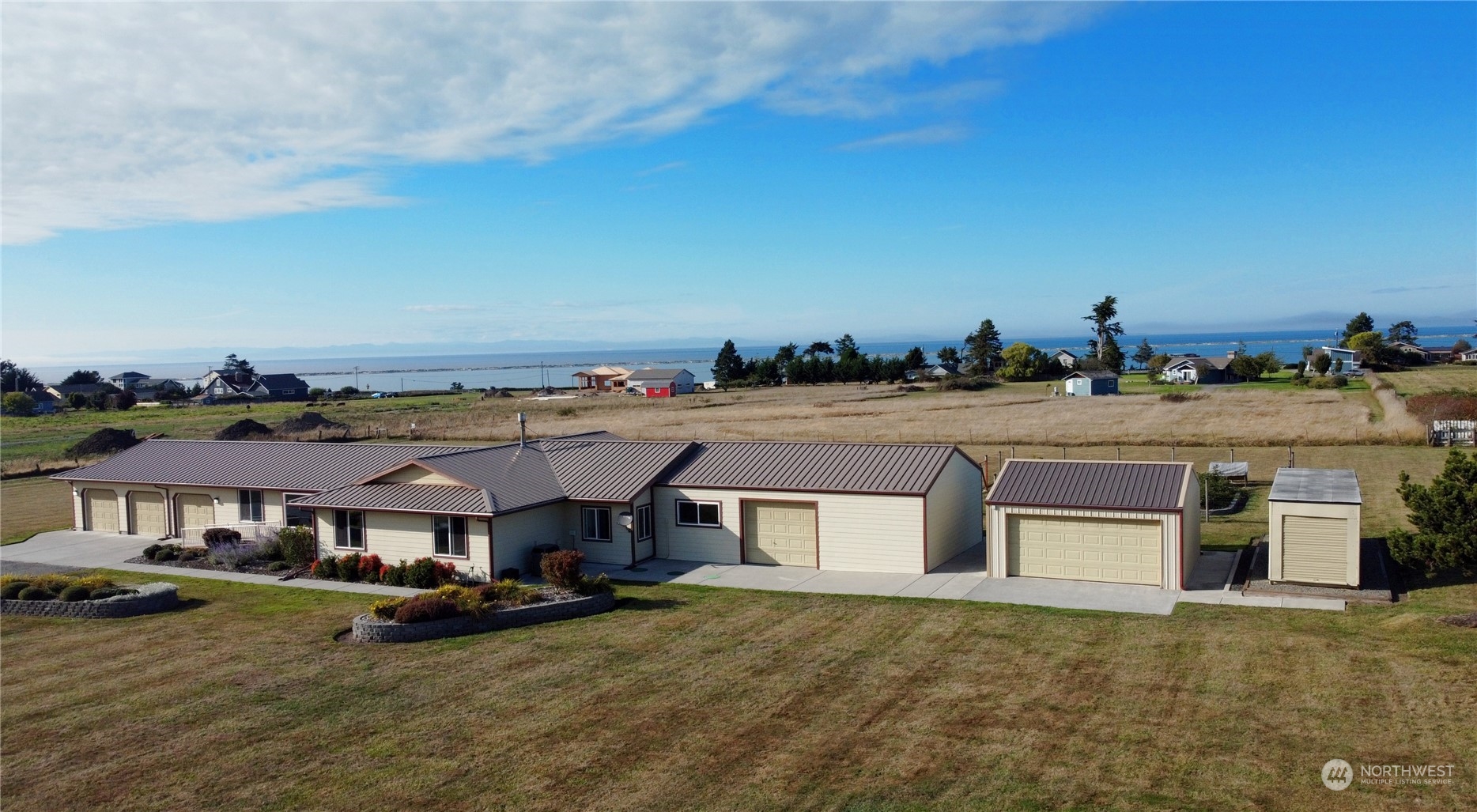 an aerial view of residential houses with yard