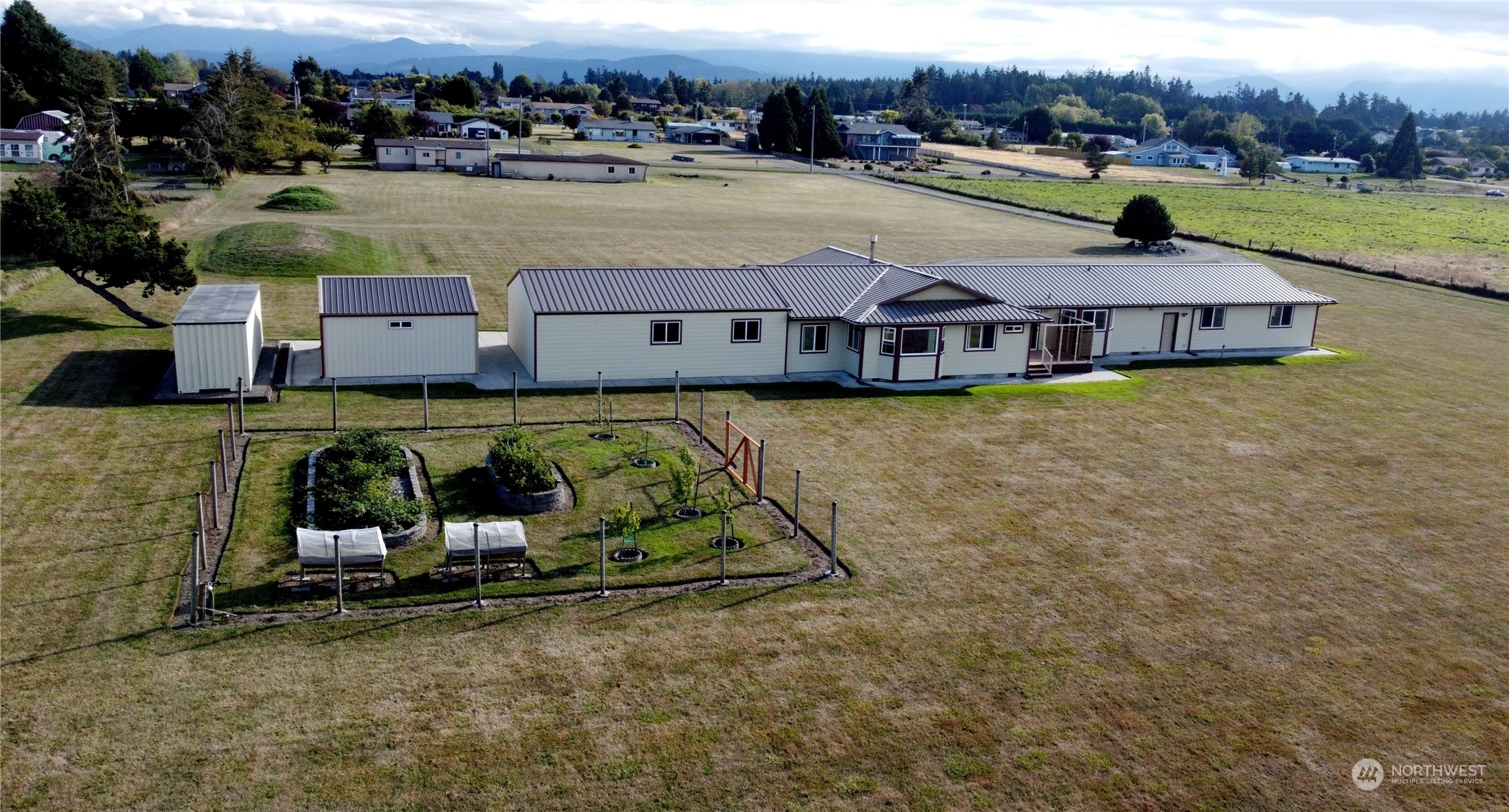 123 East Anderson Road Sequim, WA 98382 - Photo 3 of 40 an aerial view of a house with a yard pool outdoor seating and yard