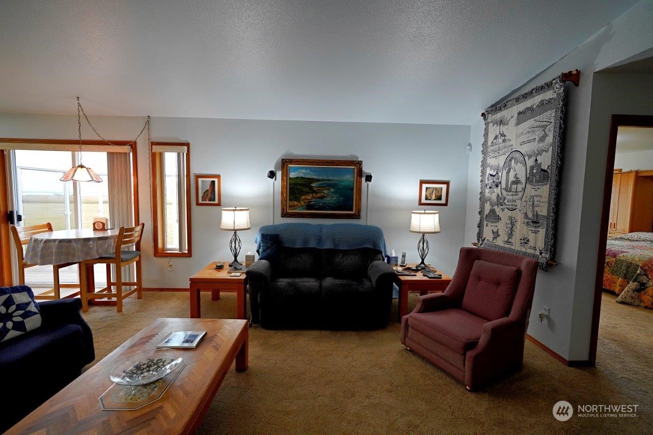 123 East Anderson Road Sequim, WA 98382 - Photo 7 of 40 a living room with furniture and a fireplace