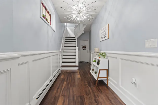 a view of entryway with wooden floor