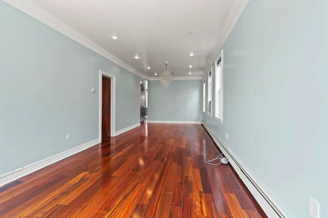 a view of hallway with wooden floor