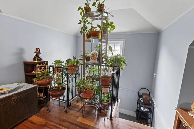 a dining room filled with furniture and flowers