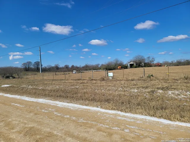 a view of a road with an ocean beach