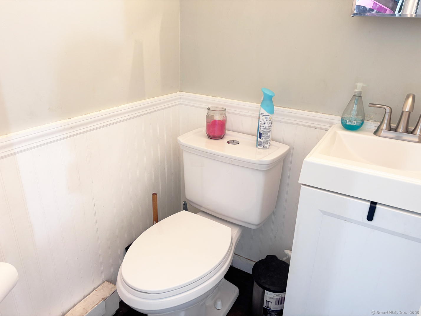 84 Taylor Avenue, Unit 1 Norwalk, CT 06854 - Photo 11 of 21 a white toilet sitting next to a bathroom sink