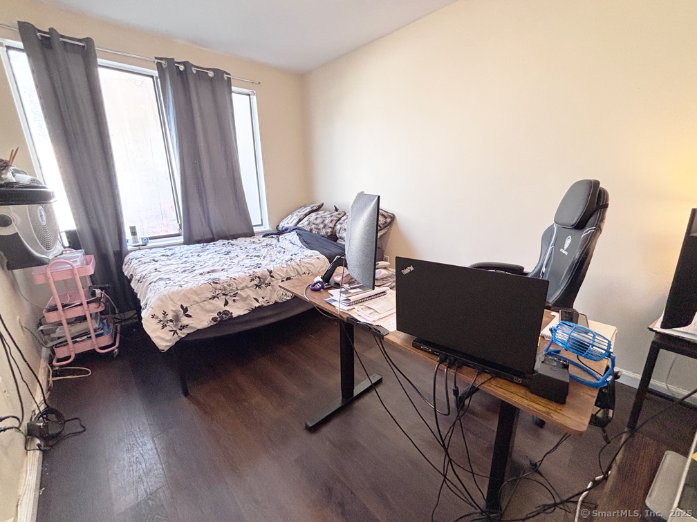 84 Taylor Avenue, Unit 1 Norwalk, CT 06854 - Photo 12 of 21 a bedroom with a bed and furniture