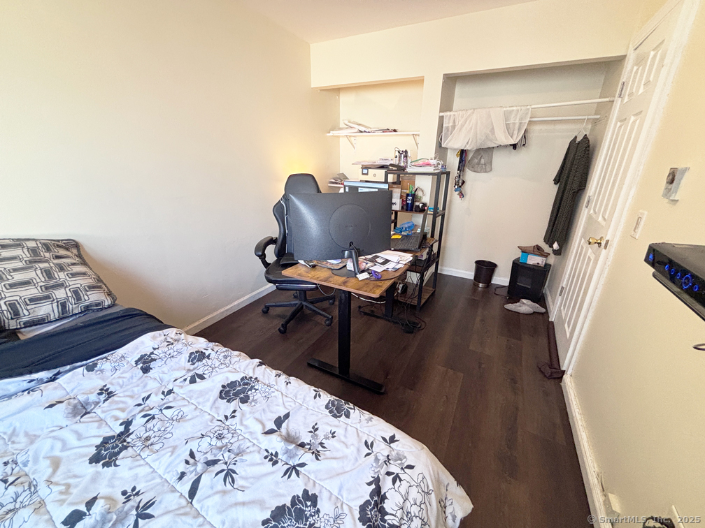 84 Taylor Avenue, Unit 1 Norwalk, CT 06854 - Photo 13 of 21 a bedroom with a bed and wooden floor