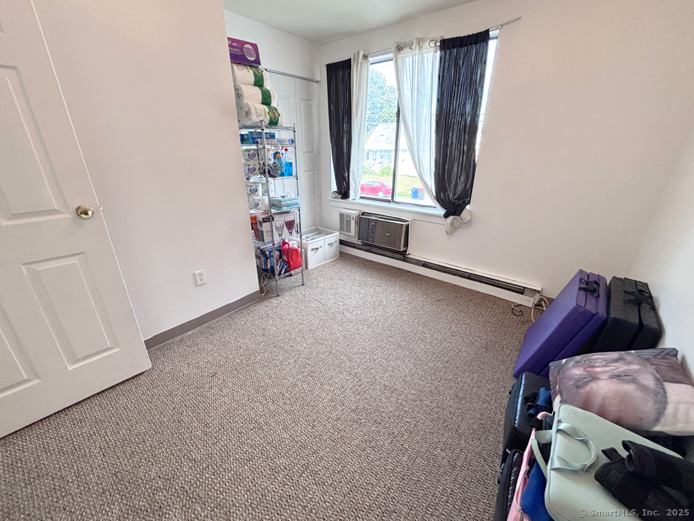 84 Taylor Avenue, Unit 1 Norwalk, CT 06854 - Photo 17 of 21 a view of a livingroom with furniture and window