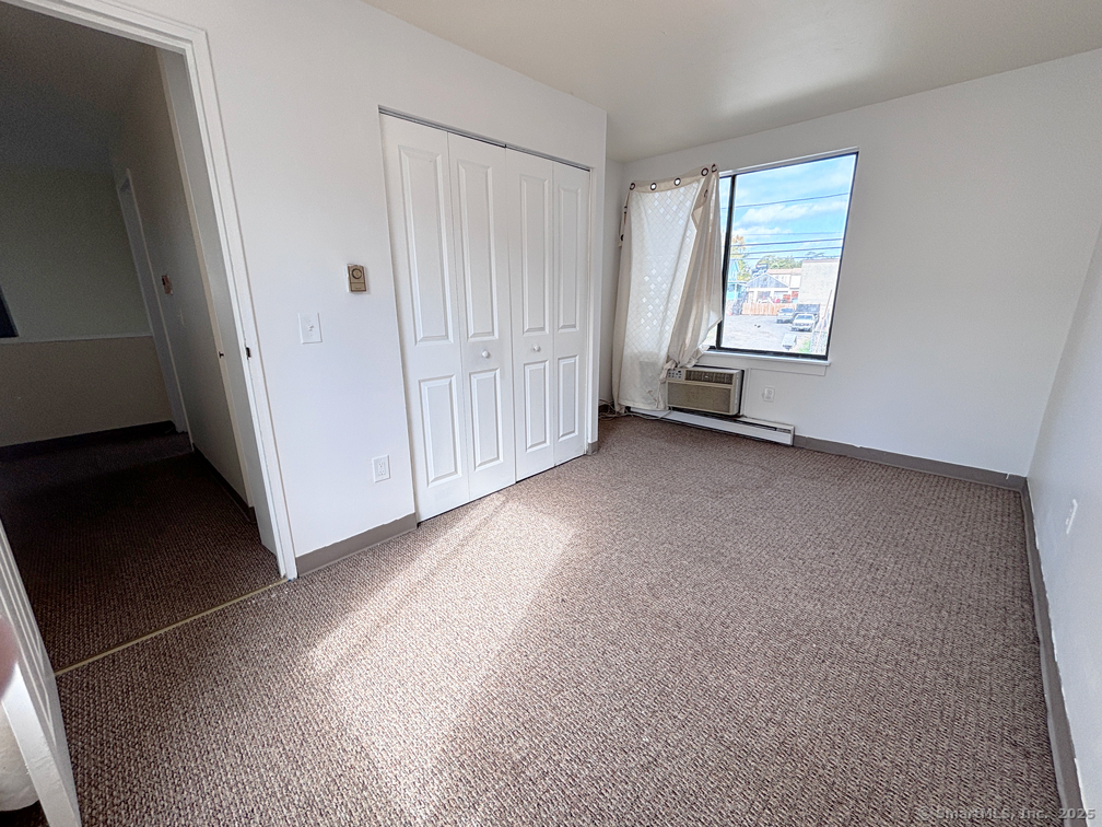 84 Taylor Avenue, Unit 1 Norwalk, CT 06854 - Photo 19 of 21 an empty room with windows