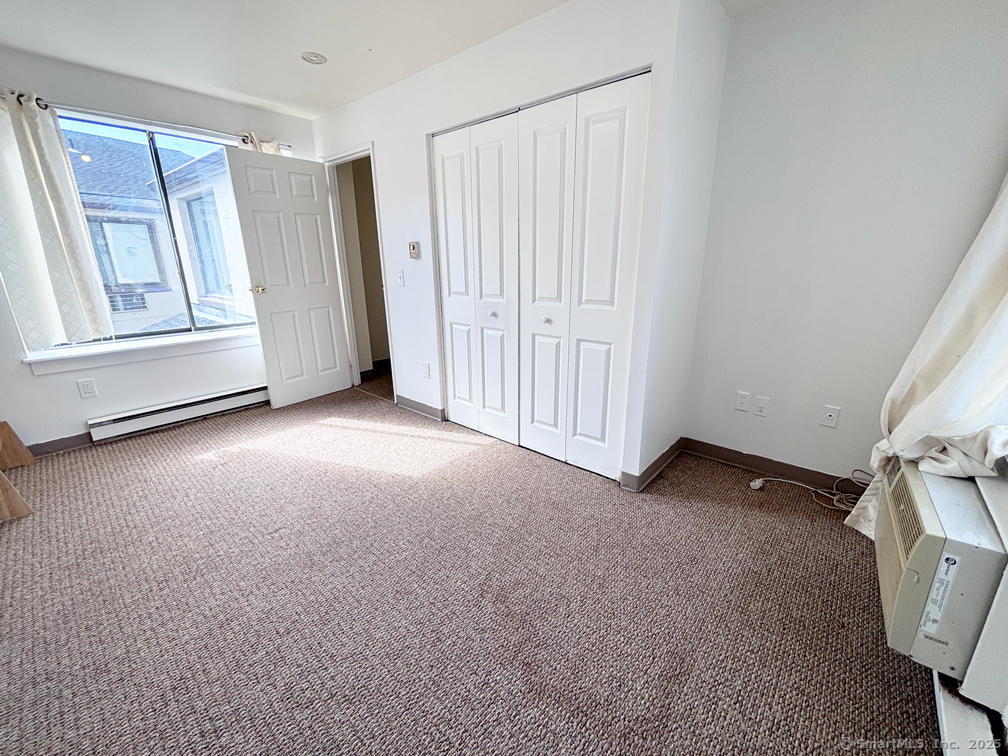 84 Taylor Avenue, Unit 1 Norwalk, CT 06854 - Photo 20 of 21 a view of an empty room with a window