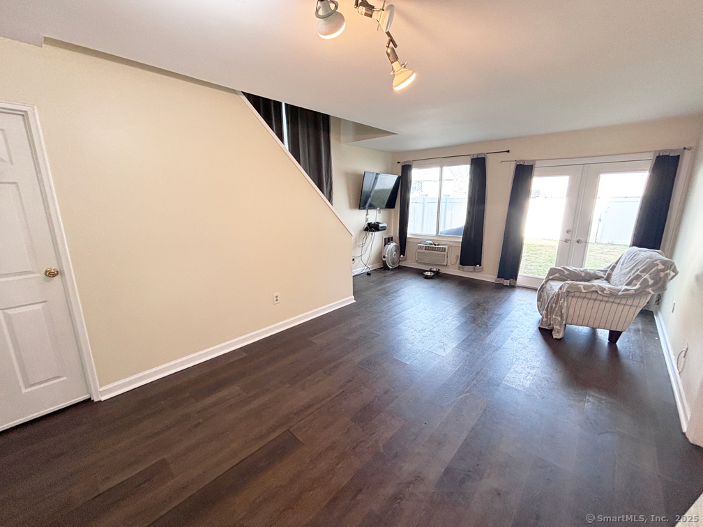 84 Taylor Avenue, Unit 1 Norwalk, CT 06854 - Photo 4 of 21 a living room with wooden floor furniture and a window