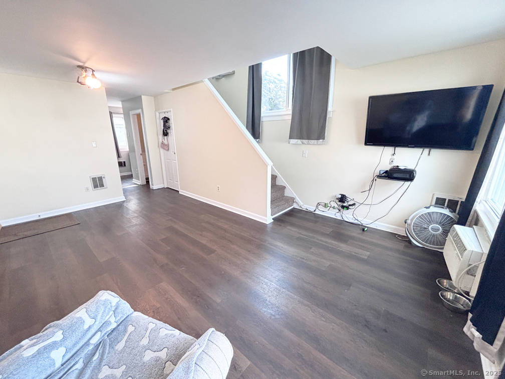 84 Taylor Avenue, Unit 1 Norwalk, CT 06854 - Photo 6 of 21 a view of livingroom with furniture and wooden floor