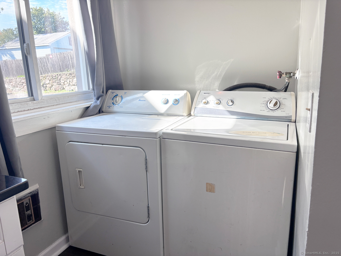 84 Taylor Avenue, Unit 1 Norwalk, CT 06854 - Photo 10 of 21 a utility room with dryer and washer