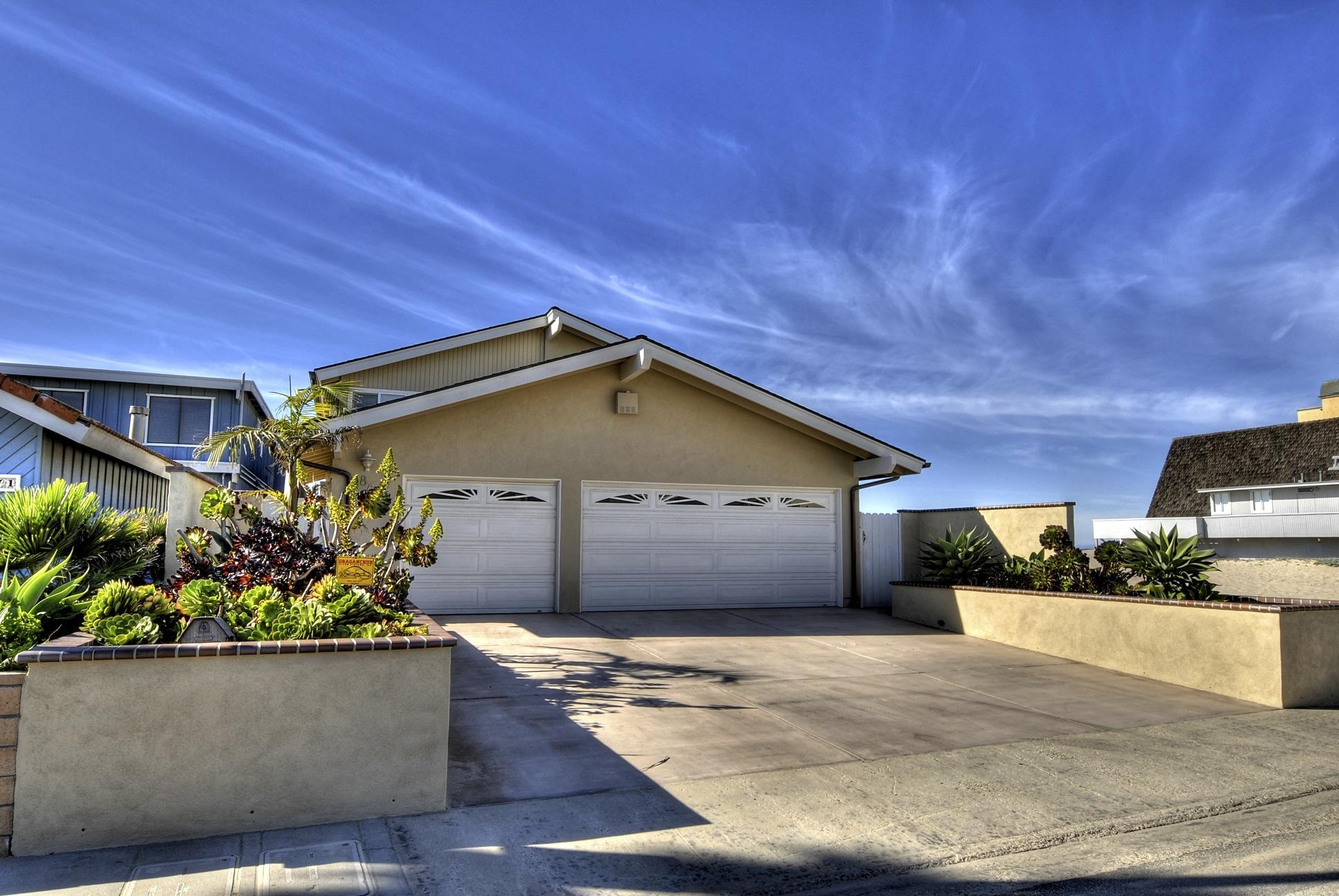 867 Mandalay Beach Road Oxnard, CA 93035 - Photo 1 of 27 a front view of a house with a yard